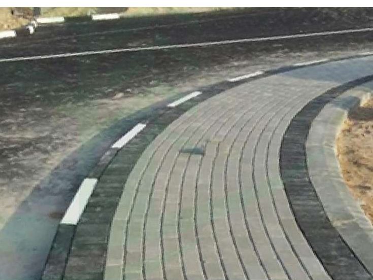 Curved interlock paver road installation