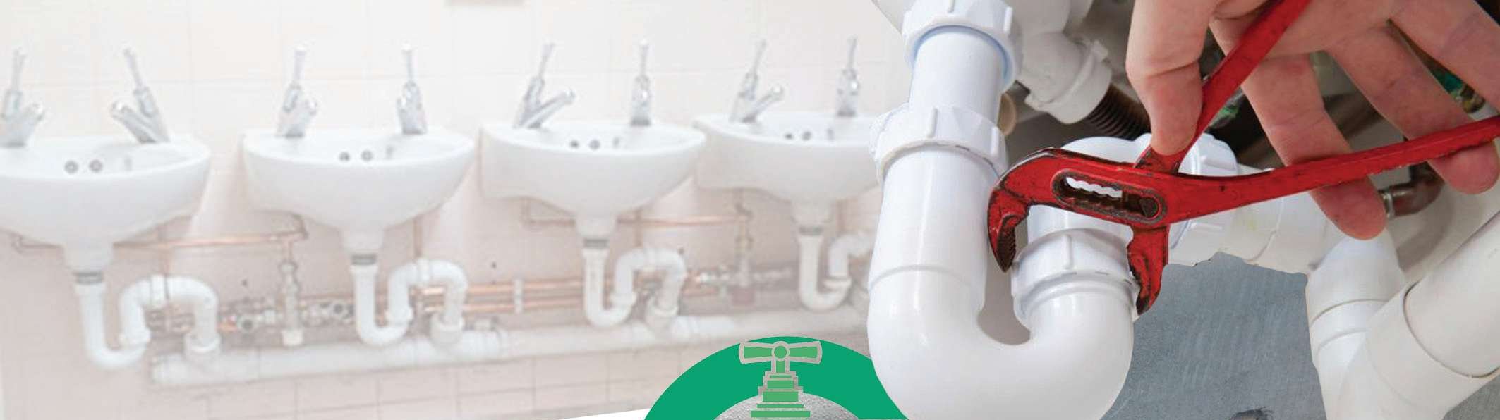 Plumber fixing pipework with a wrench